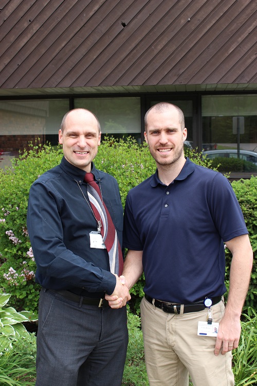 CEO Richard Bedard shakes hands with Dr. McLeod, a new physician at the DRDH